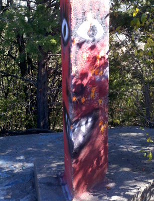 The devil-painted concrete post.